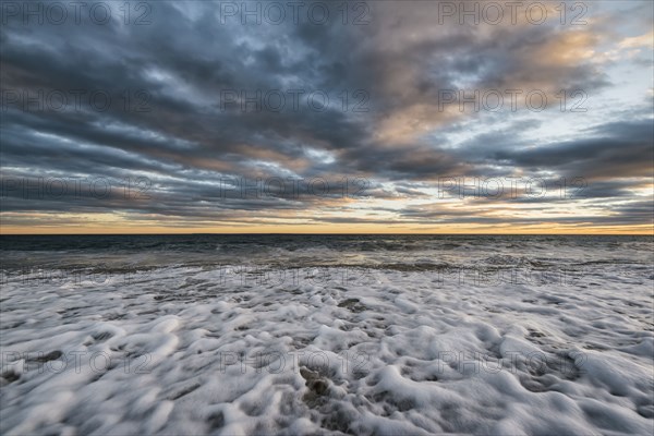 Foam in waves on ocean beach