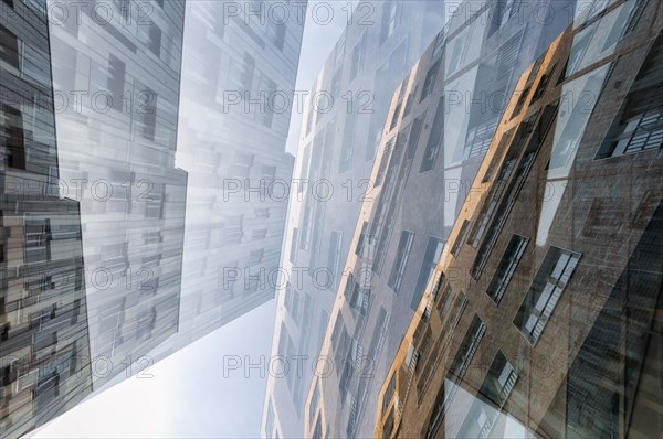 Multiple exposure of highrises under cloudy sky