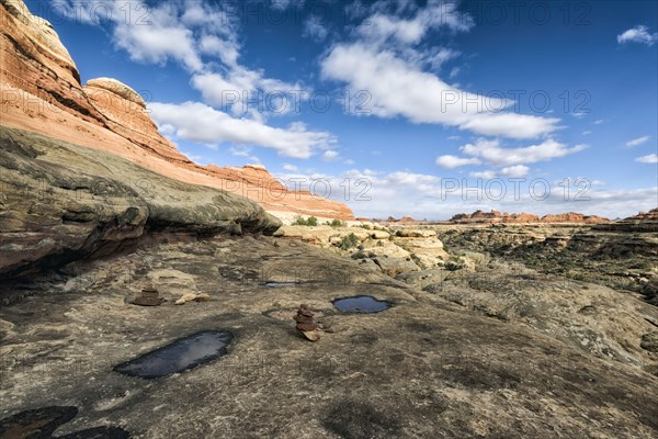 Clouds in blue sky over desert in Moab