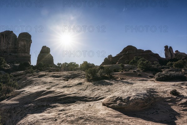 Sun in blue sky over desert