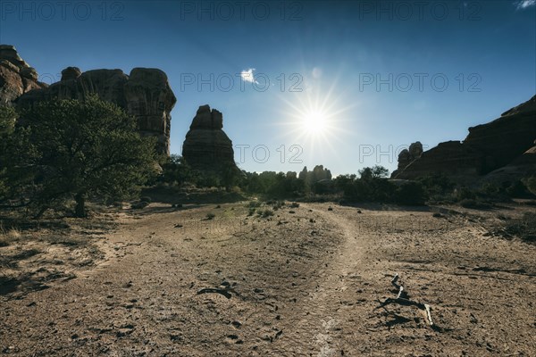 Sun in blue sky over desert