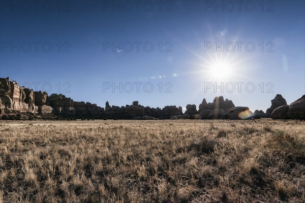 Sun in blue sky over desert