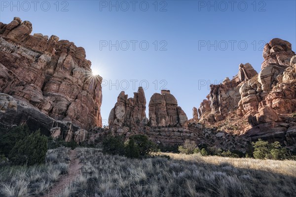 Sun in blue sky over desert