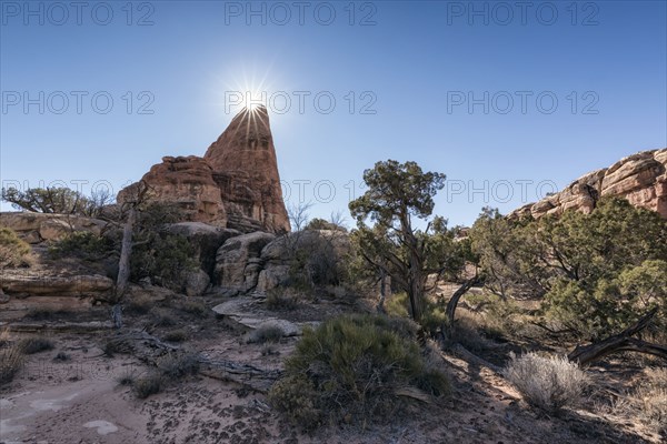 Sun in blue sky over desert