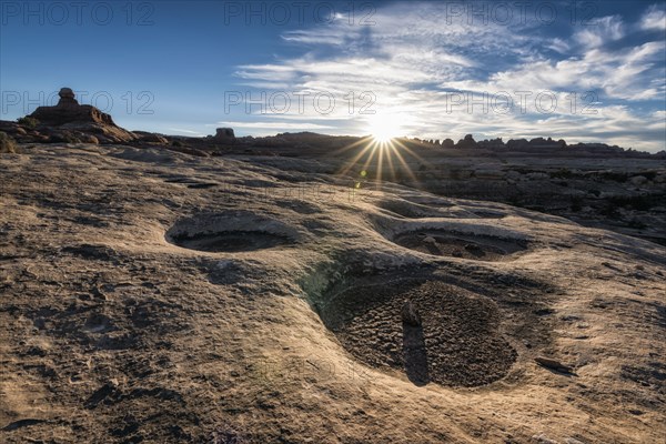 Sun in blue sky over desert