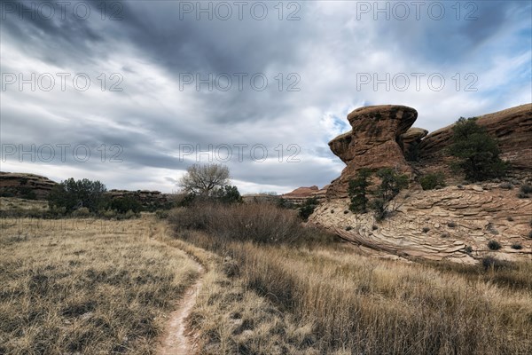 Clouds over desert path