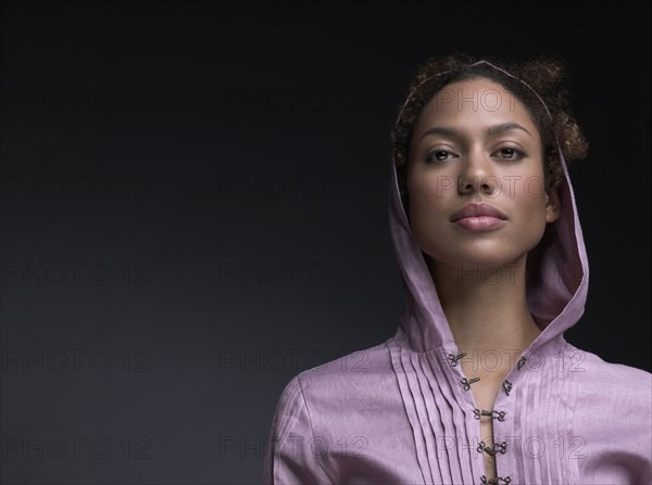 Mixed Race woman wearing hooded shirt