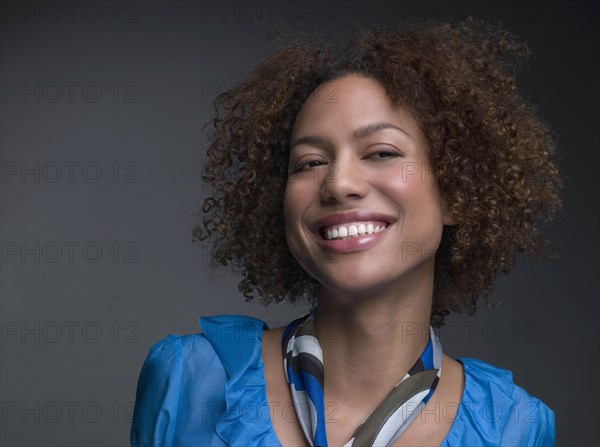 Mixed Race woman wearing scarf around neck