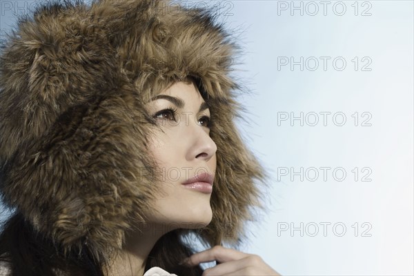 Mixed Race woman wearing fur hat