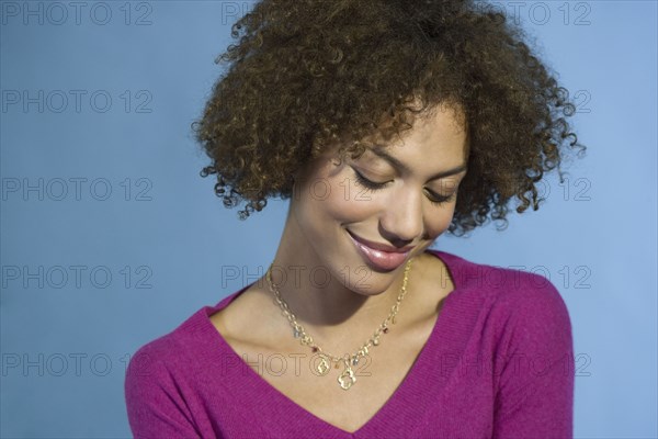 Mixed Race woman looking down