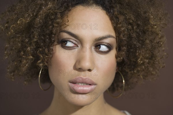 Mixed Race woman looking sideways