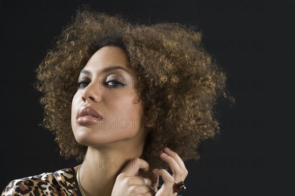 Mixed Race woman pulling hair