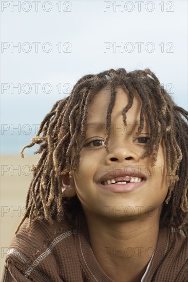 Mixed Race boy with dreadlocks