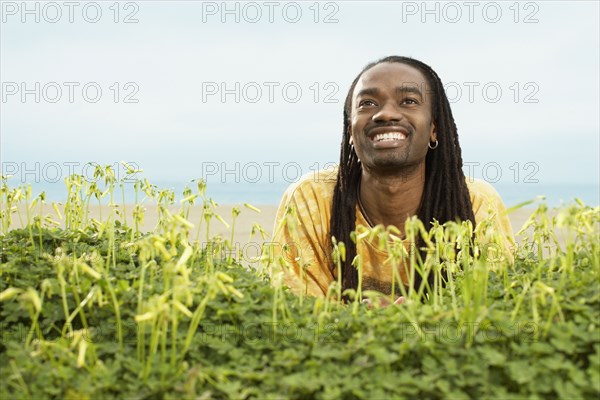 African man looking up