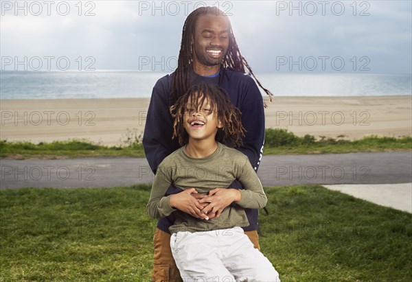 African father playing with son