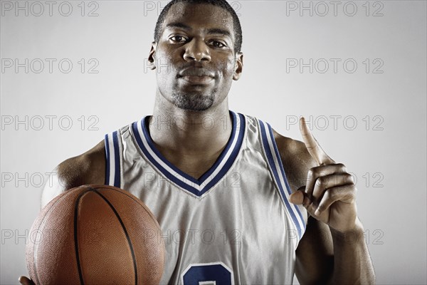 African basketball player holding basketball