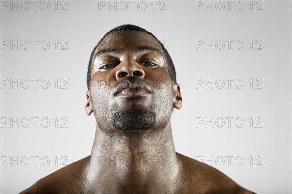 Serious African man sweating