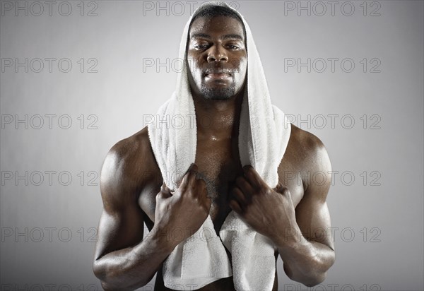 Sweating African man with towel