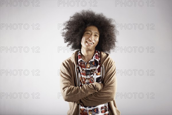 Confident mixed race man with arms crossed