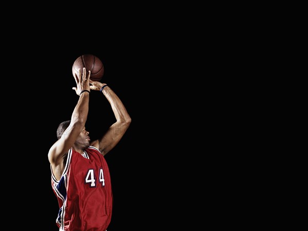 African basketball player shooting basketball