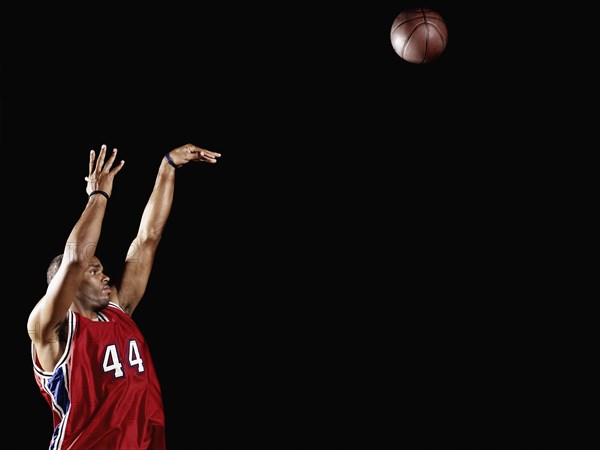 African basketball player shooting basketball