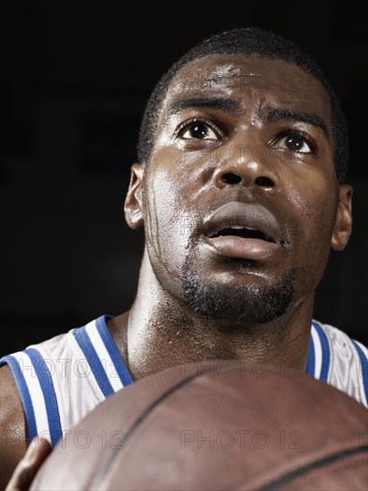 African basketball player shooting basketball