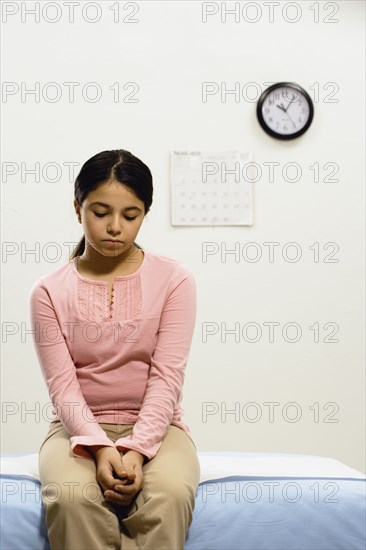 Girl waiting in doctors office