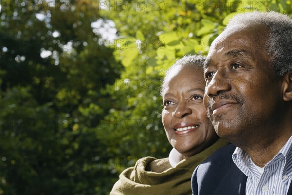 Close up of senior African couple smiling outdoors