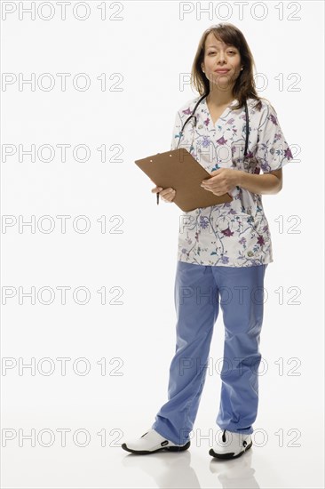 Studio shot of female nurse with chart