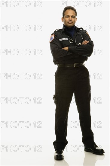 Studio shot of Hispanic male paramedic