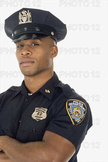 Studio shot of African male police officer