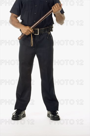 Studio shot of African male police officer