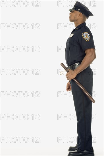 Studio shot of African male police officer