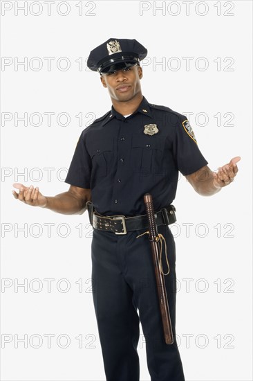 Studio shot of African male police officer