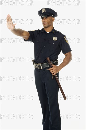 Studio shot of African male police officer