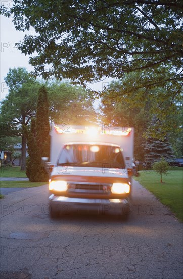 Ambulance with lights on in residential area