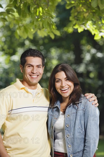 Young Hispanic couple smiling outdoors