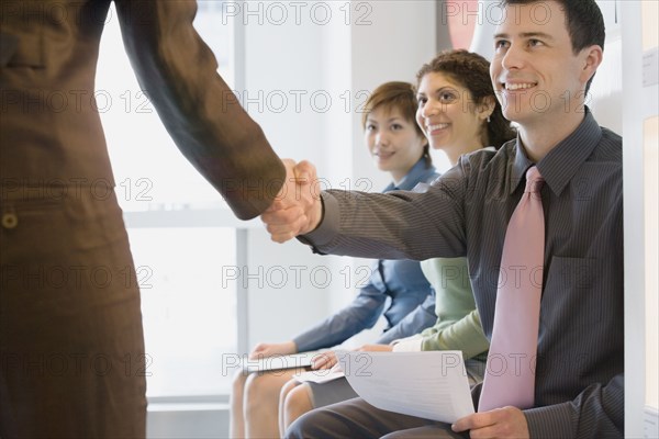 Young businessman shaking hands