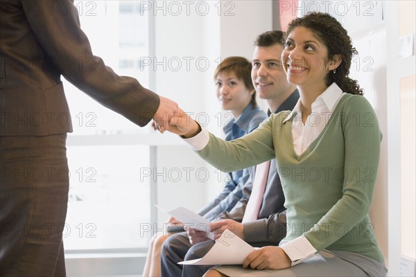 Young businesswoman shaking hands