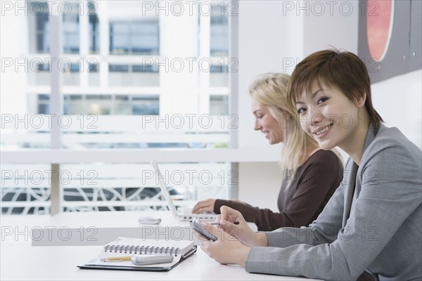 Multi-ethnic businesswomen in cafe