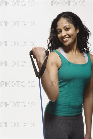 Indian woman using exercise band