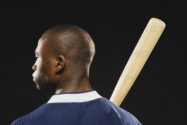 African American man holding baseball bat