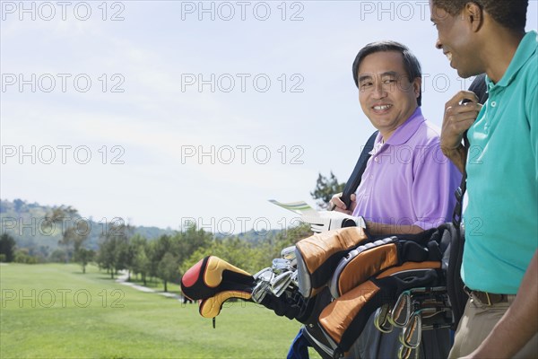 Multi-ethnic men on golf course