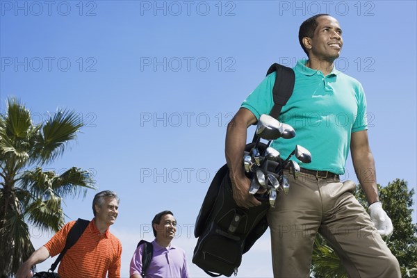 Multi-ethnic men on golf course