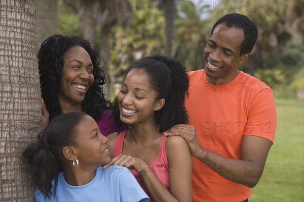 African family next to tree