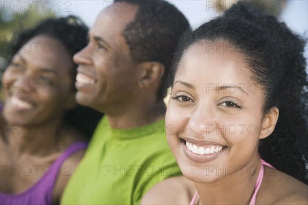 African woman with family in background