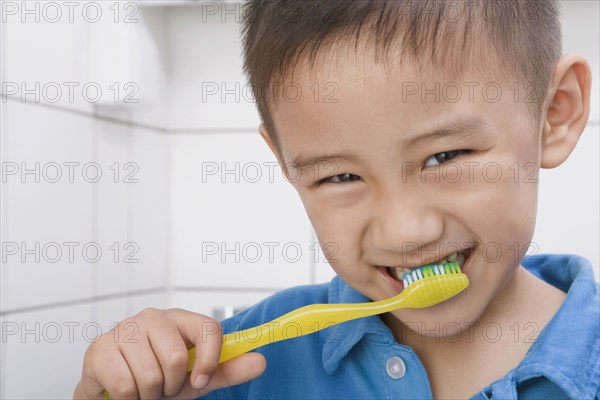 Chinese boy brushing teeth