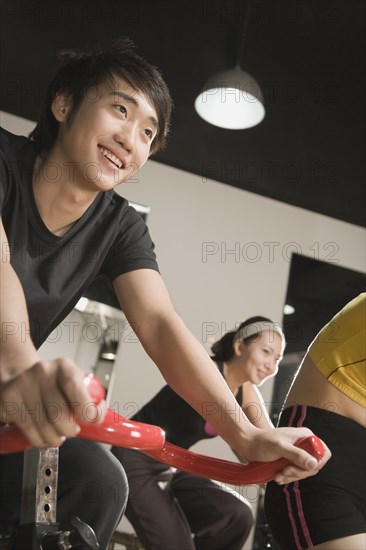 Chinese people using exercise bicycles