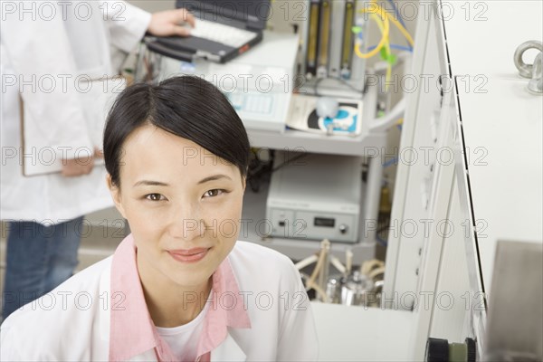 Chinese scientist in laboratory smiling