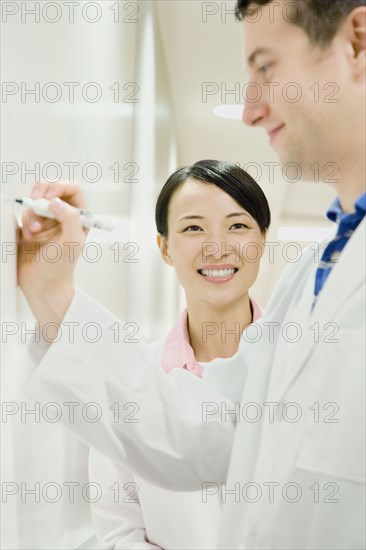 Scientists working in laboratory